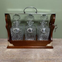 Stunning Mahogany Tantalus with Gin, Whiskey & Brandy Silver Decanter Labels