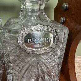 Stunning Mahogany Tantalus with Gin, Whiskey & Brandy Silver Decanter Labels
