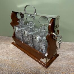 Stunning Mahogany Tantalus with Gin, Whiskey & Brandy Silver Decanter Labels