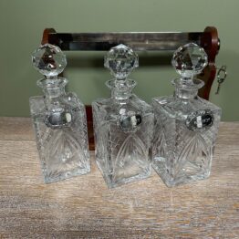 Stunning Mahogany Tantalus with Gin, Whiskey & Brandy Silver Decanter Labels